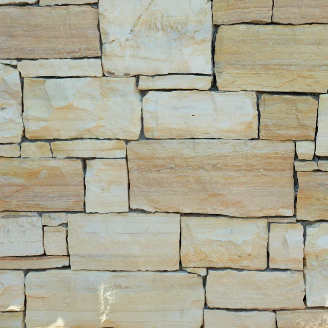 Rectangular Winter Ridge Blend limestone blocks in cream, white and warm buff tones with close dry-stack joints.