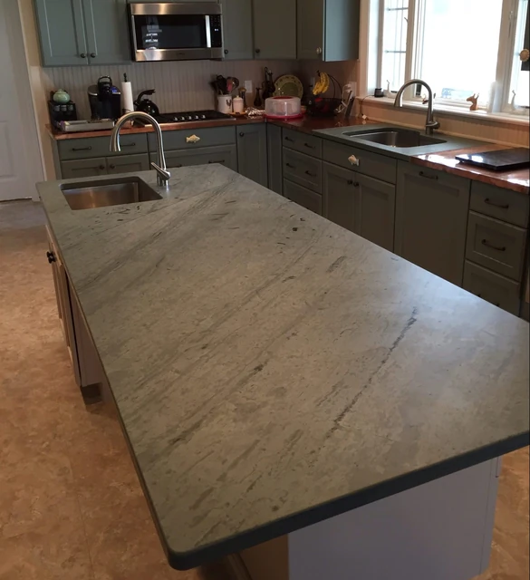 Unfading Green slate island countertop showing the broad honed stone surface.