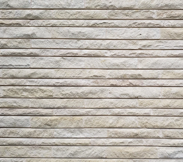 Lueders Splitface | Roughback Limestone: Lueders Splitface, sawn top and bottom, random lengths in a running bond pattern.