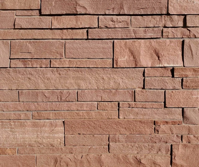 Lyons Red sandstone in Rocky Mountain Rose random ledgestone, with varied horizontal courses.