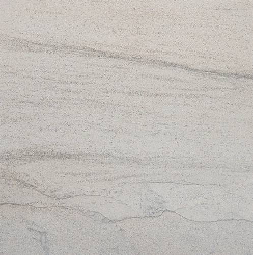 Sterling limestone sample showing a light gray field and fine wavy veins.
