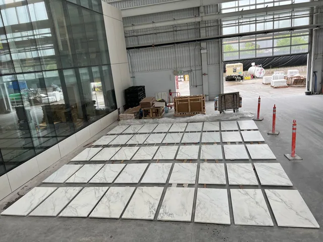 Rows of Crème Extra cut-to-size panels arranged for the FIS Headquarters project.