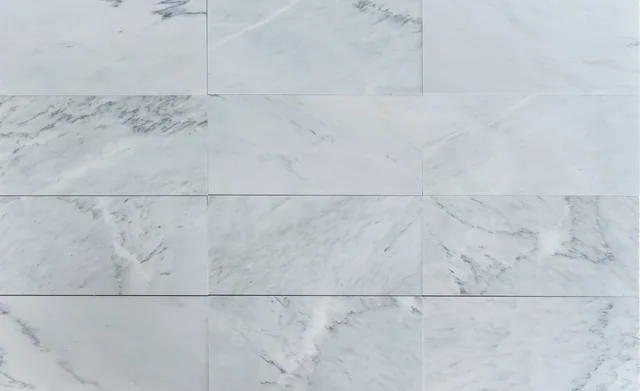 An arrangement of Silver Cloud marble pieces with varied gray veining.