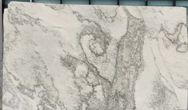Alabama Scuro marble slab with a warm ground and branching dark mineral movement.