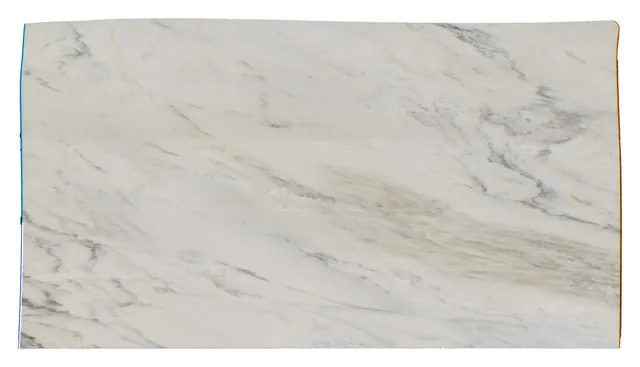 Crème Extra slab with an ivory ground and gray mineral movement.
