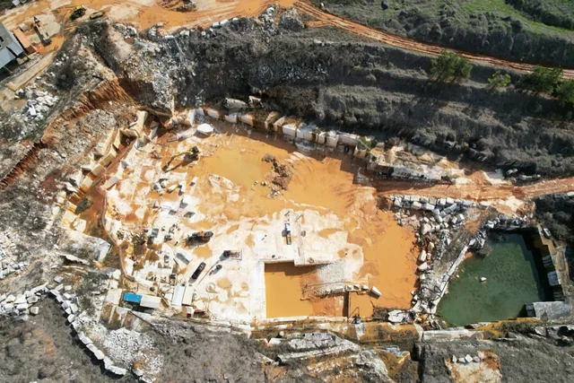 Aerial view of marble extraction areas, benches and blocks at Sylacauga Marble Quarry.