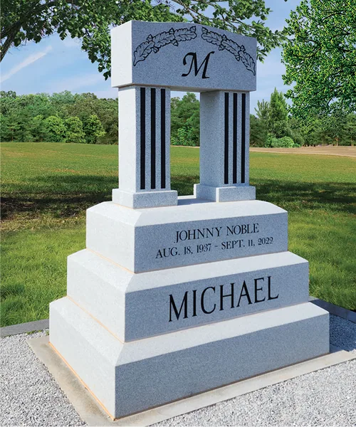 Blue Ribbon quarry granite formed into a gray memorial with fluted columns and an engraved cap.